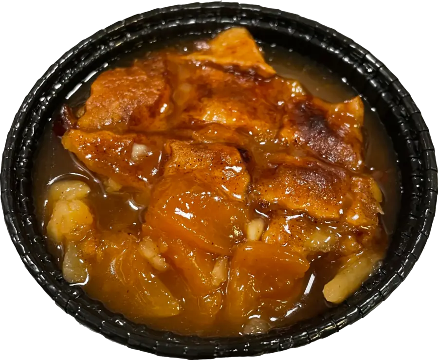 Peach cobbler dessert served at Test Kitchen BBQ in Waukegan
